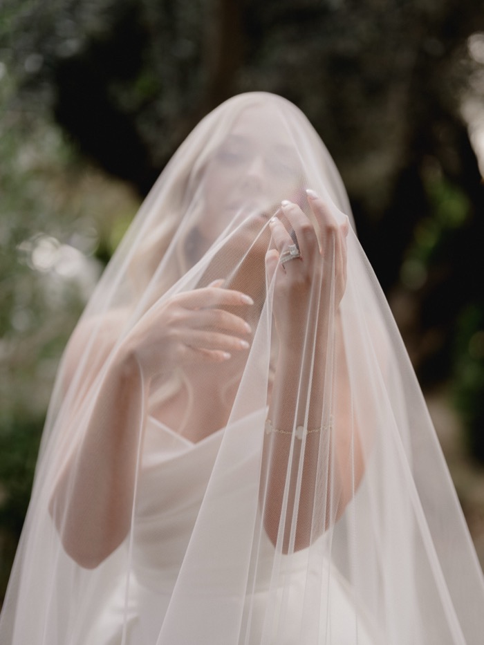 Bride beneath her veil, photographed by Paul Von Rieter