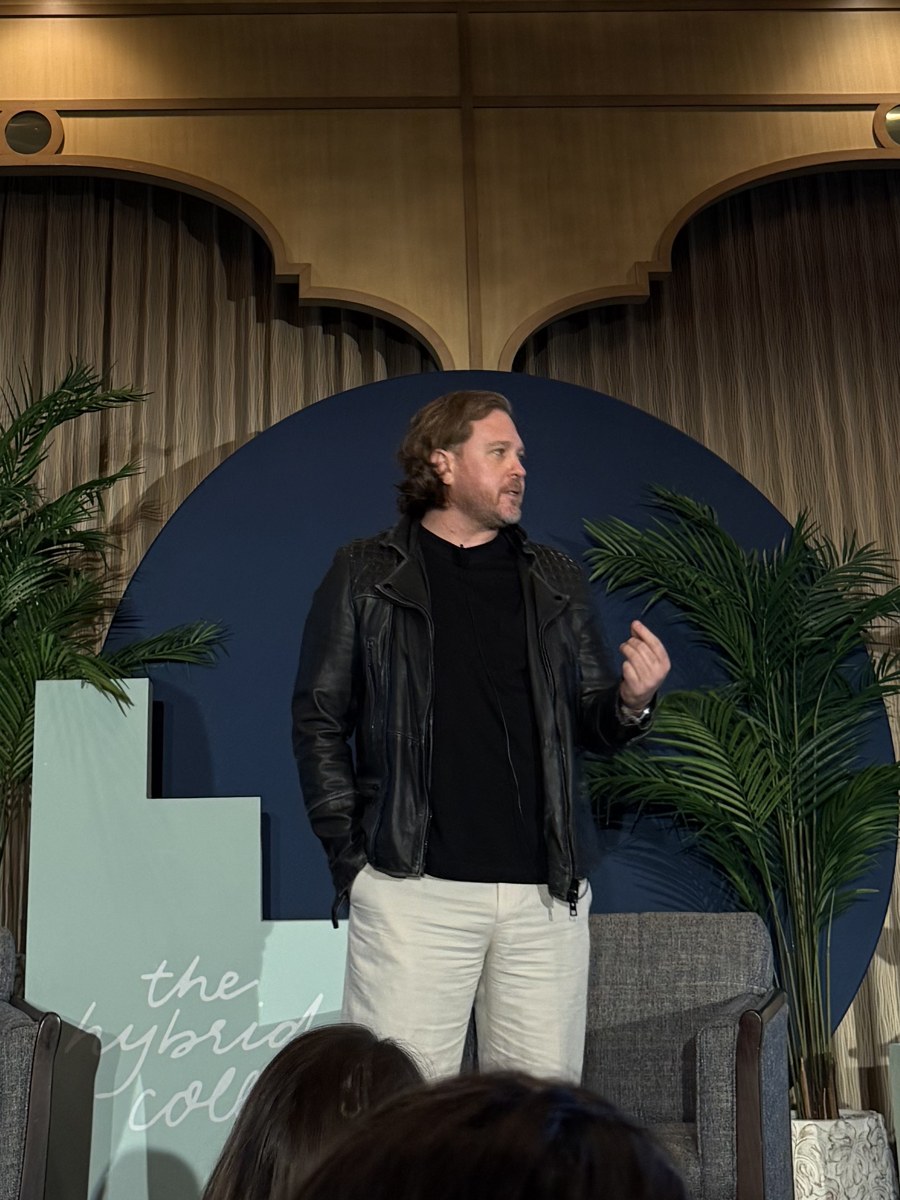 Paul Von Rieter speaking on stage at The Hybrid Co